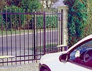 car in front of gate